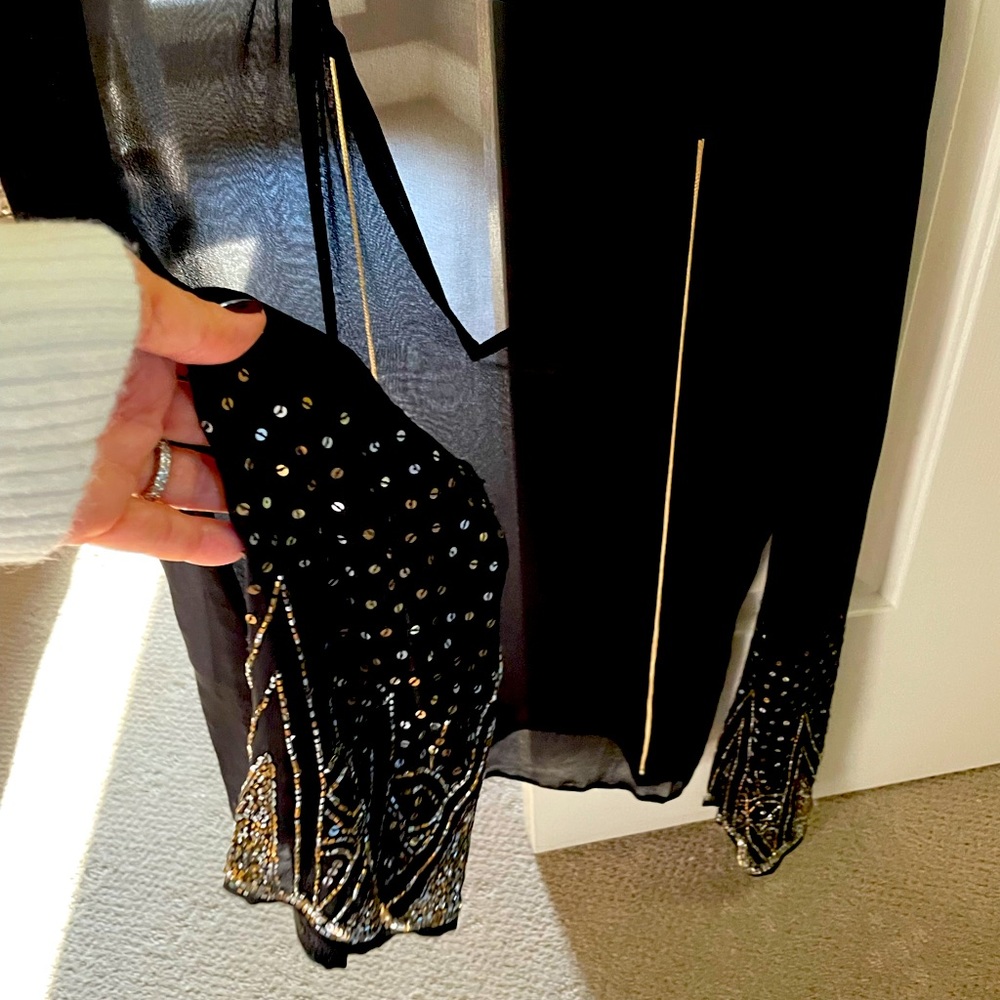 Beautiful black sheer top w/beaded detailing on sleeves